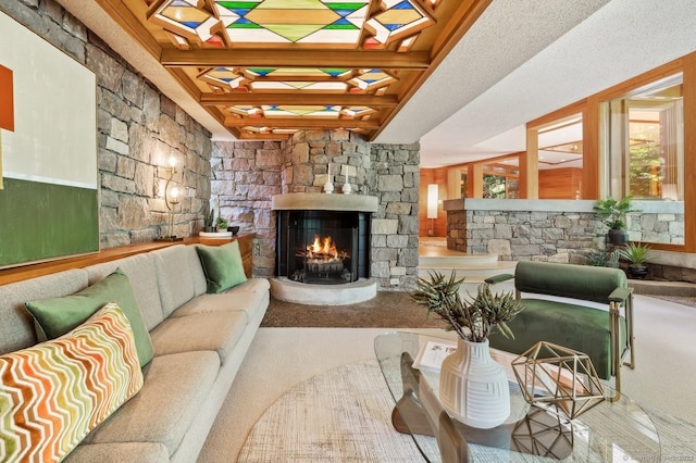 living room featuring a fireplace and beam ceiling