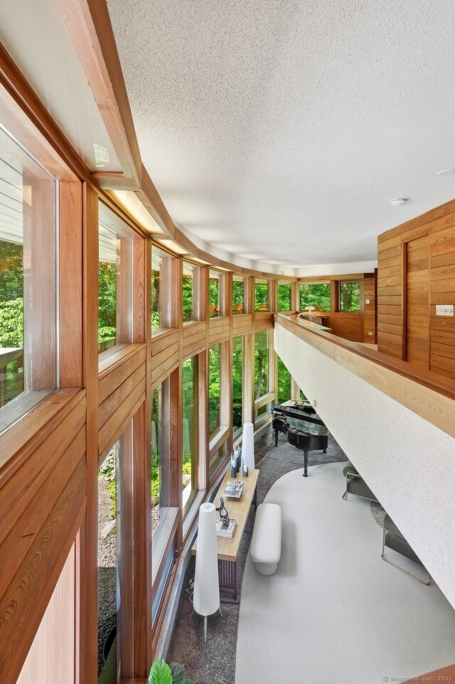 22 Father Peters Ln, New Canaan, CT 06840 - sunroom / solarium with a textured ceiling, healthy amount of natural light, and carpet floors