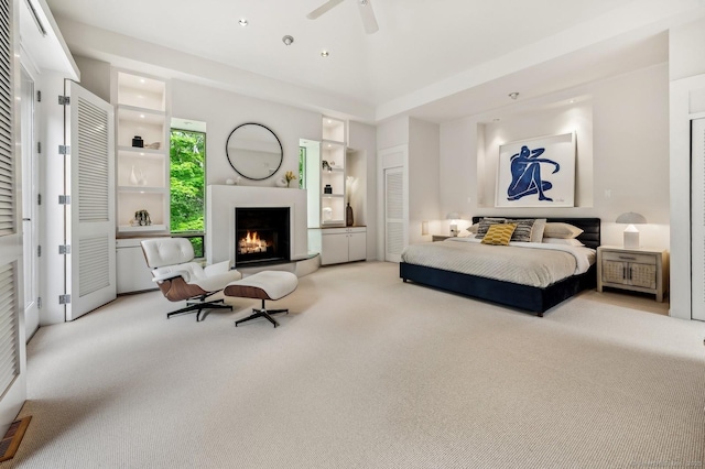 bedroom featuring ceiling fan and light carpet