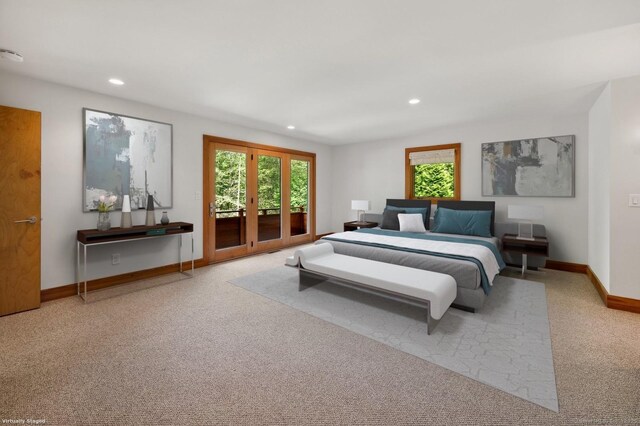 carpeted bedroom with access to exterior and french doors