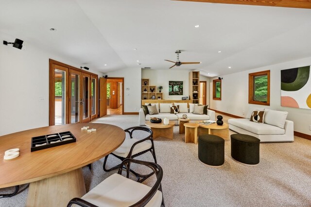 living room with light carpet, vaulted ceiling, french doors, and ceiling fan