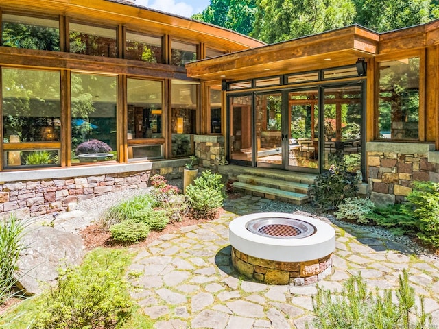 view of patio / terrace with an outdoor fire pit