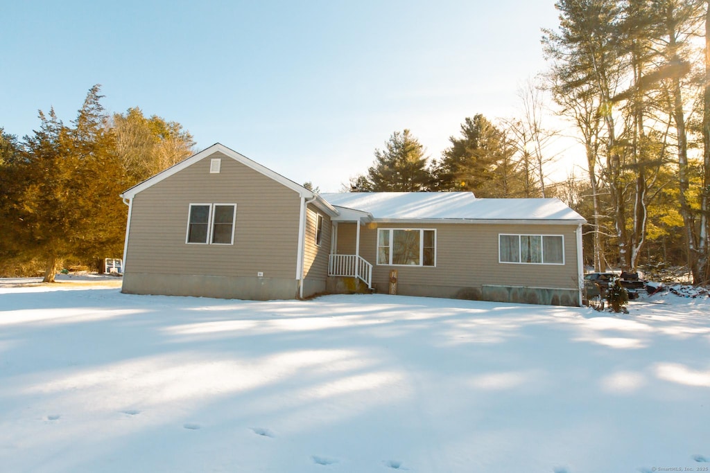 view of snow covered house