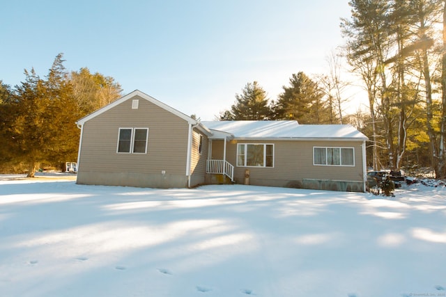 view of snow covered house