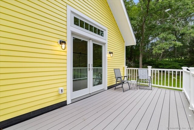 wooden deck featuring french doors