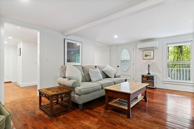 living area featuring baseboards, hardwood / wood-style flooring, a wall mounted AC, beam ceiling, and recessed lighting