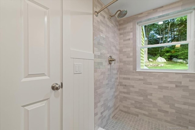 bathroom with a tile shower