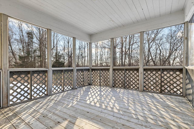 unfurnished sunroom featuring wooden ceiling