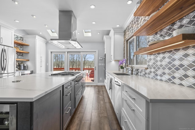 kitchen featuring wine cooler, a sink, white cabinetry, open shelves, and island exhaust hood