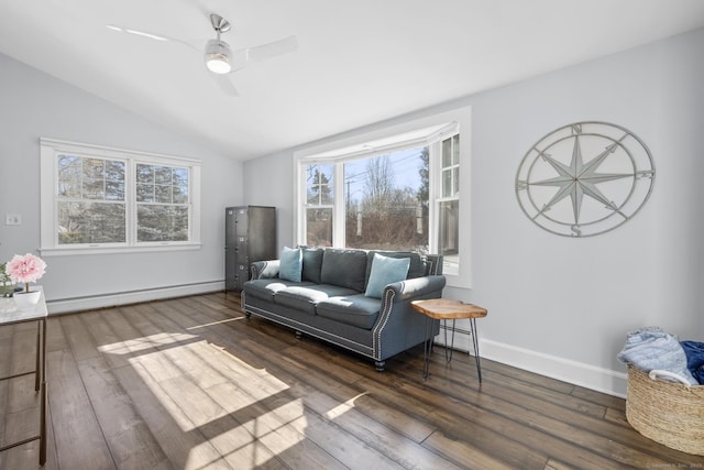 living area with baseboards, a ceiling fan, lofted ceiling, dark wood-style floors, and a baseboard heating unit