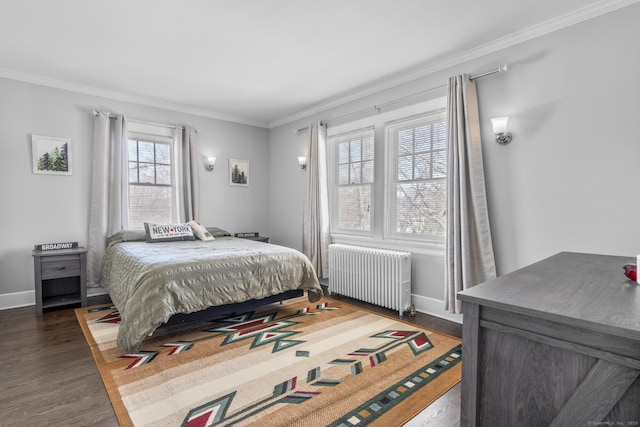 bedroom with dark wood-style floors, ornamental molding, baseboards, and radiator