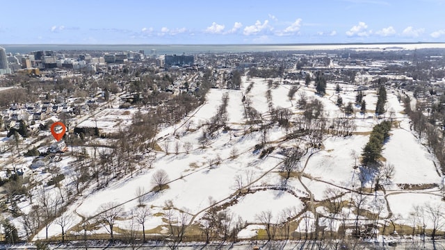 snowy aerial view featuring a city view