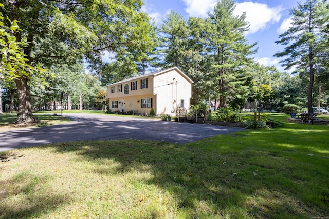 exterior space with a yard and a trampoline