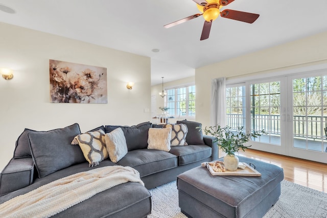 living room featuring hardwood / wood-style floors and ceiling fan