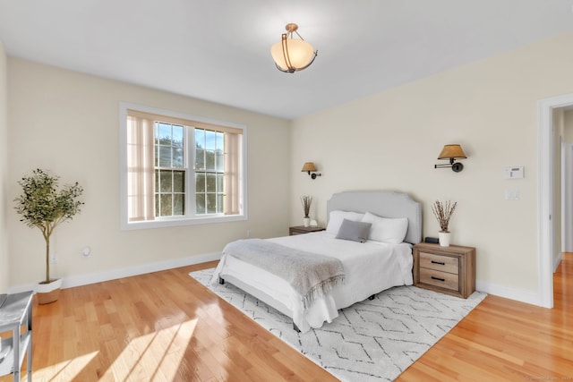 bedroom with wood-type flooring