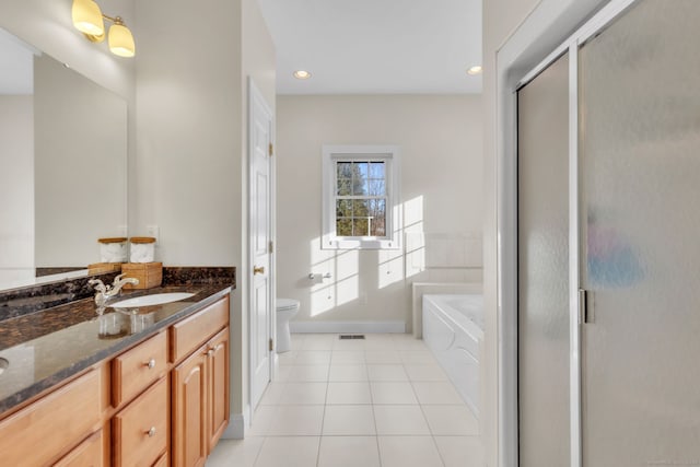 full bathroom featuring vanity, tile patterned floors, independent shower and bath, and toilet