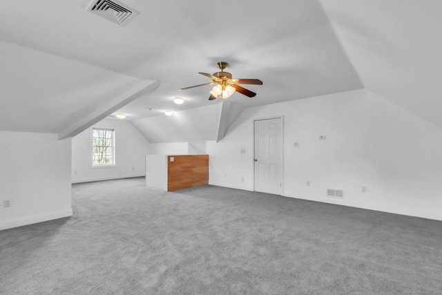 bonus room featuring vaulted ceiling, ceiling fan, and carpet