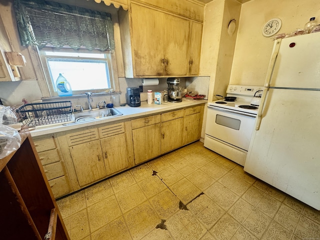 kitchen with white appliances and sink