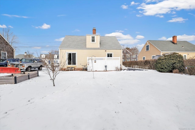 view of snow covered house