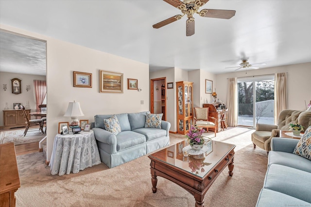 carpeted living room featuring ceiling fan