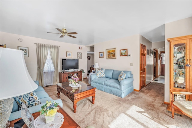 living room with light carpet and ceiling fan