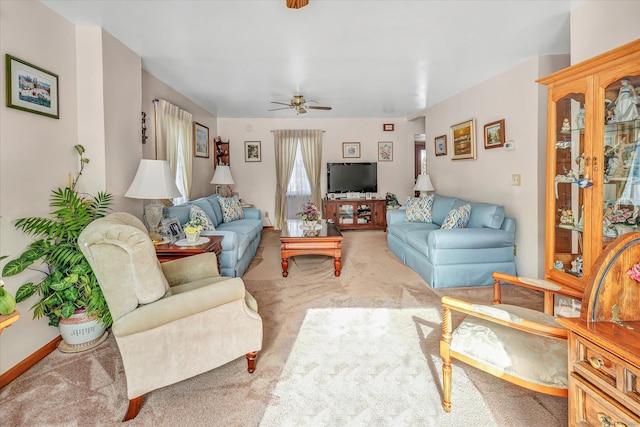 living room with light colored carpet and ceiling fan