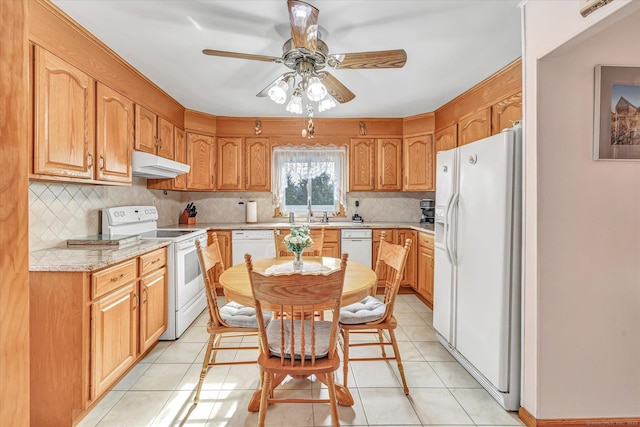 kitchen featuring tasteful backsplash, light tile patterned floors, white appliances, and ceiling fan