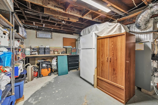 basement featuring white refrigerator