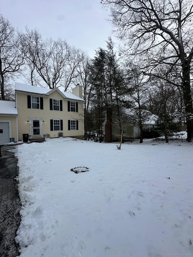 view of yard layered in snow