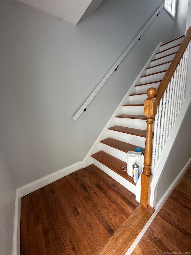 staircase featuring hardwood / wood-style floors