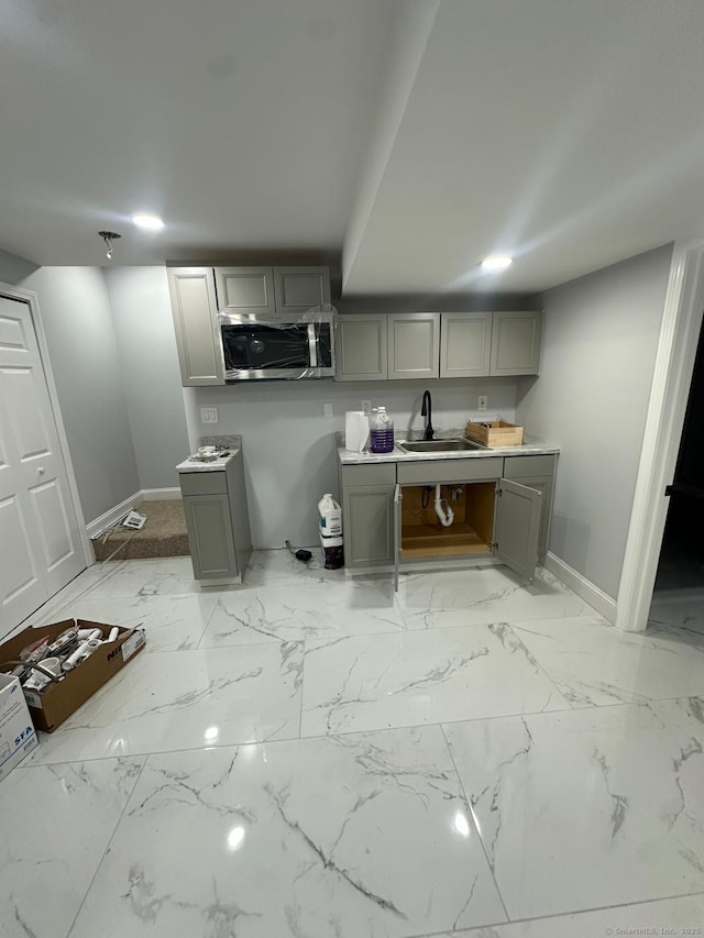 kitchen with sink and gray cabinetry