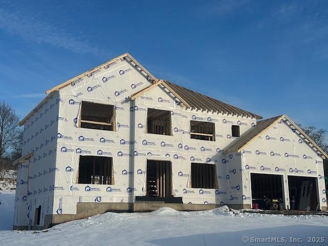 unfinished property with a garage