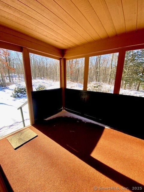 unfurnished sunroom featuring plenty of natural light