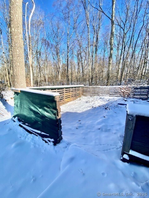 view of yard layered in snow