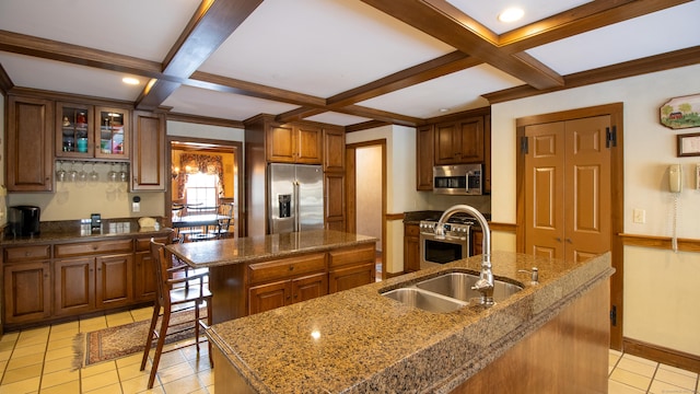 kitchen featuring appliances with stainless steel finishes, sink, and a spacious island