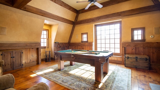 recreation room with ceiling fan, pool table, light wood-type flooring, and wood walls