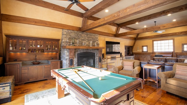 game room featuring hardwood / wood-style flooring, ceiling fan, beam ceiling, and billiards