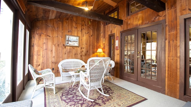 sunroom / solarium with wood ceiling, plenty of natural light, french doors, and beamed ceiling