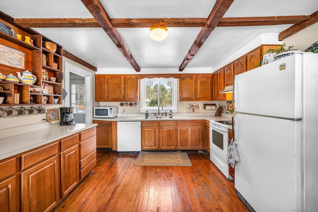 kitchen featuring dark wood-type flooring, white appliances, beam ceiling, and sink