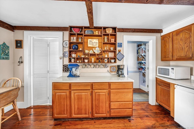 kitchen with dark wood-type flooring, white appliances, and beam ceiling