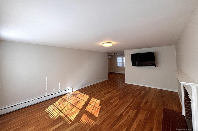 unfurnished living room with a baseboard radiator and dark hardwood / wood-style floors