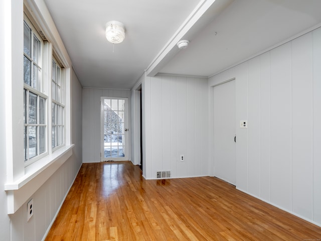 unfurnished room with light hardwood / wood-style floors