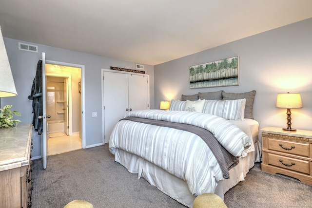 bedroom featuring a closet, carpet, and ensuite bathroom