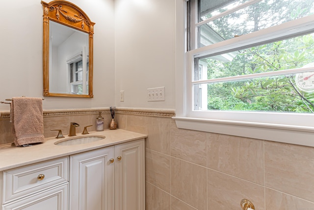 bathroom with plenty of natural light and vanity