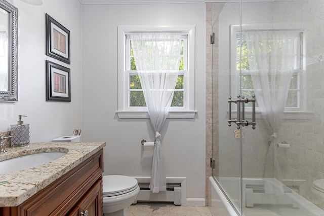 full bathroom featuring vanity, toilet, enclosed tub / shower combo, and baseboard heating