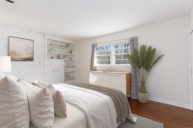 bedroom with wood-type flooring