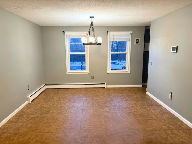 unfurnished dining area with a textured ceiling and a chandelier