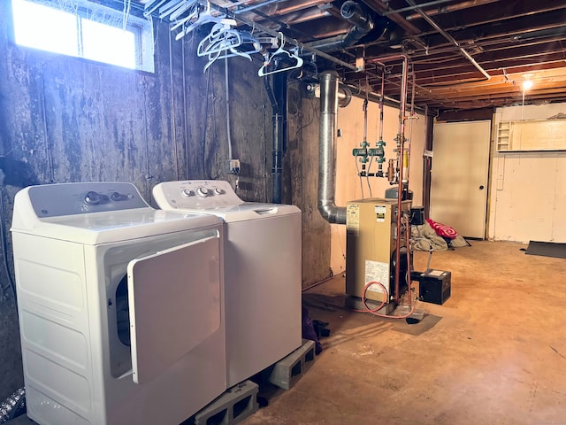 clothes washing area featuring separate washer and dryer