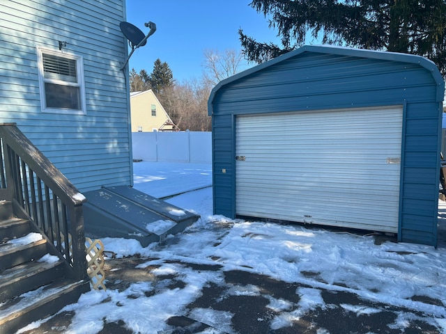 view of snow covered garage