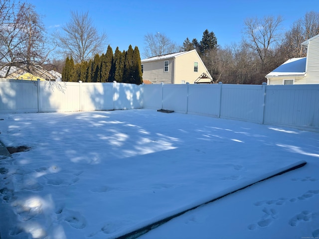 view of yard layered in snow